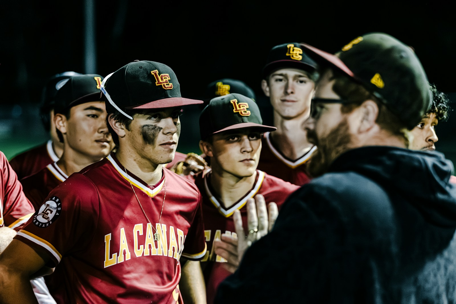 Baseball team coach huddle